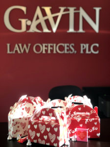 Valentine's themed treat boxes sit atop the front desk at Gavin Law Offices